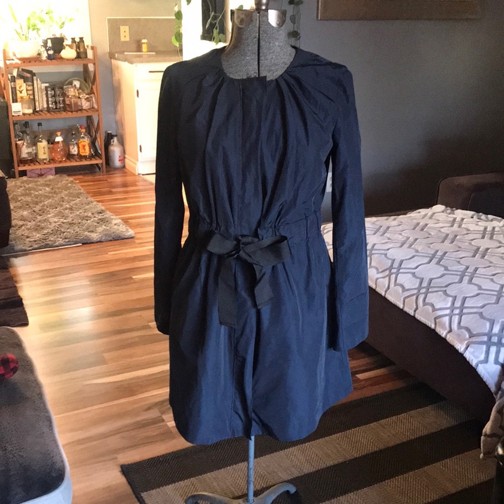 Navy blue pea coat/rain jacket.